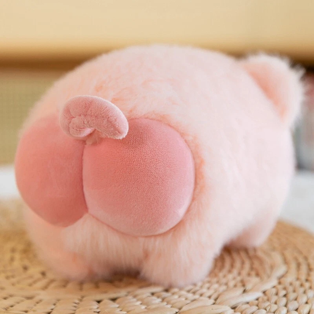 Close-up of Piggy Puff™ pig plushie showing adorable round piggy bottom in soft plush material