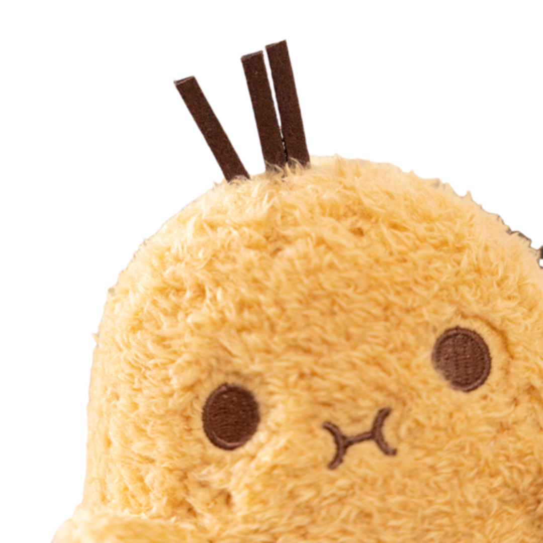Close-up of Snug Spud™ plushie’s cute embroidered face and soft texture, premium plush toy from Fluffy Haven